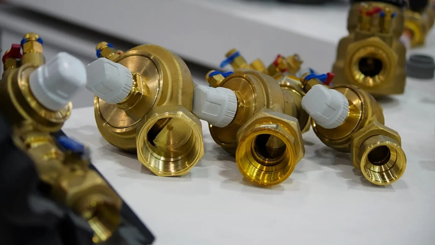 A row of brass radiator valves